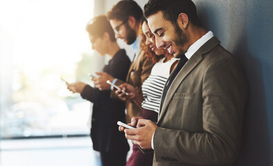 Poster - Business people, workplace row and phone for texting, communication and online connection with social media. Happy, professional employees and creative company, email and web search on app together