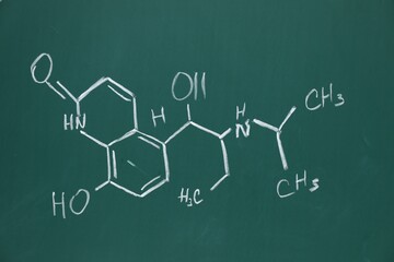 Wall Mural - Chemical formulas written with chalk on green board