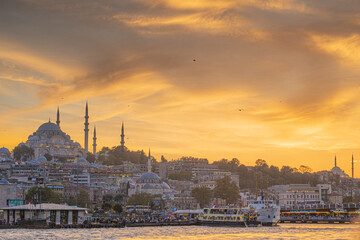 Colorful orange evening sky over the city of Istanbul with Bosphorus Sea and Ayasofia