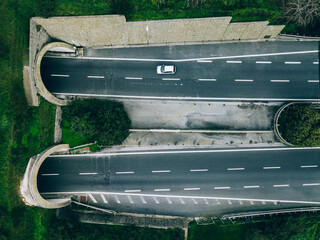 Wall Mural - Aerial view of highway road tunnel in mountains, Italy.