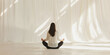 © Mr. Stocker - Woman meditating in white room