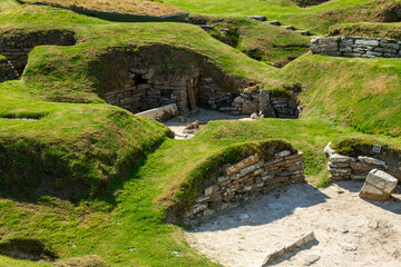 Skara Brae Scotland neolithic site ona  sunny day from Kirkwall port, stone building from ancient times