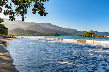 Wall Mural - Remote Castelhanos beach on Ilhabela island with mountains and forest around