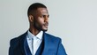 © AlfaSmart - Man in a sharp blue suit looks to the side, exuding confidence and style