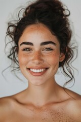 Wall Mural - Portrait of happy latin woman with beautiful skin on white background.