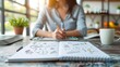 © rookielion - A visionary entrepreneur sketching personal business plans in a stylish notebook