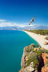 Sticker - Serene turquoise waters of Mediterranean sea and Konyaalti beach, framed by mountains and deep blue sky in Antalya, Turkey. Welcome to Antalya concept image