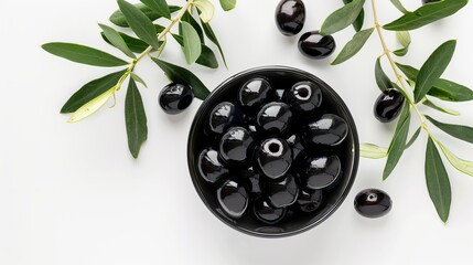 Wall Mural - Black olives in a bowl and green olive branches on white background. Elegant food presentation. Ideal for marketing, blogs, and stock photos. High-quality image perfect for culinary uses. AI