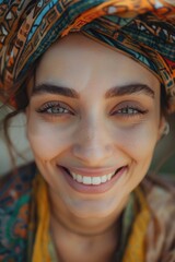 Wall Mural - Close-up portrait of a person wearing a turban, looking straight into the camera