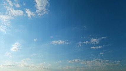 Clouds moves in the blue sky. Clouds running across brilliant blue sky. Natural abstract background. Time lapse.