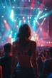 © Aquir - Girls in stylish clubbing outfits partying at a concert. Crowd of people having fun at a music festival. Nightlife concept