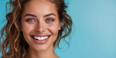 Wall Mural - Lovely broad smile of a young, healthy woman with excellent white teeth. Separated from the background