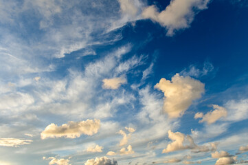 Wall Mural - Full frame of the low angle view of sky and clouds of yellow and orange color and the in the sunset. 1