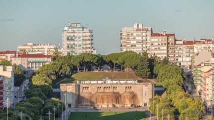 Wall Mural - Fonte Luminosa fountain aerial timelapse. Alameda public park in the city center. Residential buildings. It was built to celebrate regular water supply to the eastern part of Lisbon. Portugal.