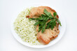 © Lushchikov Valeriy - Juicy fried chicken fillet with rice on a plate. Delicious breakfast with meat and rice.