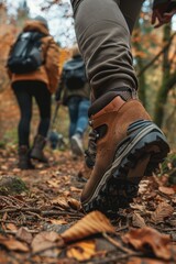 close up of people hiking in a forest,walking on a trail wearing outdoor shoes on blur background