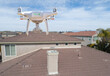 © Andy Dean - Quadcopter UAV Drone Flying A Residential Roof Inspection.