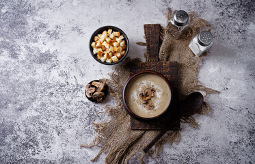 Wall Mural - Roasted mushroom champignons soup with cream and croutons in a bowl