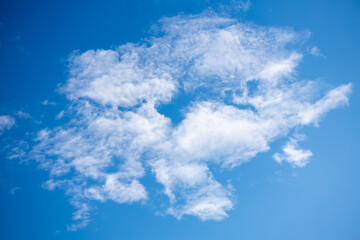 Wall Mural - White clouds on blue spring sky