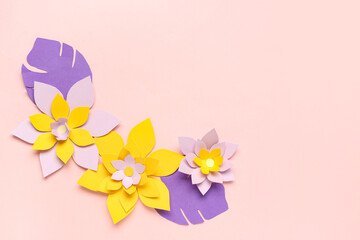 Wall Mural - Colorful origami flowers with leaves on pink background