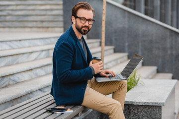 Wall Mural - handsome busy bearded man working in park