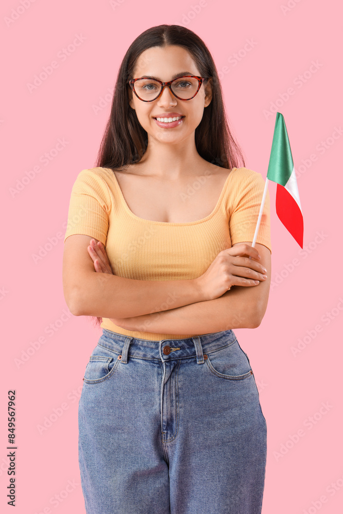 Young woman with Mexican flag on pink background