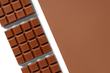 Wall Mural - Composition with tasty chocolate bars on color background