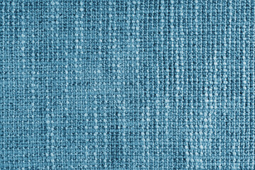 Wall Mural - Jacquard woven coarse weave texture upholstery blue fabric. Textile background, furniture textile material, wallpaper, backdrop. Cloth structure close up, macro.