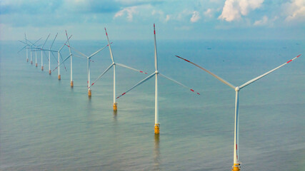 Wall Mural - panoramic view of wind farm or wind park, with high wind turbines for generation electricity with co