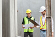 © DG PhotoStock - Engineer team discuss and examine a building construction.