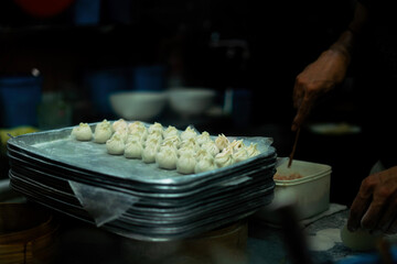 Sticker - making of traditional chinese dumplings