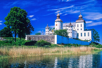 Canvas Print - Old baroque castle by the lake in Sweden