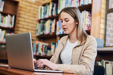 Poster - Woman, typing and laptop in library for research, education and exam preparation on campus. Female student, studying and technology at table for knowledge, communication and learning on internet