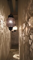 Poster - Elegant Islamic lanterns casting intricate shadows against a white wall, creating a captivating display.