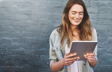 Poster - Mockup, smile and tablet with designer woman on brick wall background for creative research. Innovation, space and technology with happy employee outdoor on space for professional web development