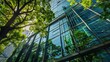 © PaulShlykov - Sustainble green building. Eco-friendly building in modern city. ESG. Sustainable glass office building with green tree. Office with green environment. Corporate sustainability. Net zero emission.