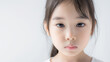 © ALL AGES - 9 years old Asian female, sad or blank or serious expression, copy space