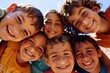 © Inigo - Group of children smiling and looking at the camera on a sunny day