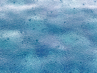 Sticker - Raindrops on blue pool water. Background