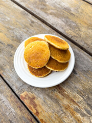 Sticker - Pancakes in a plate on a wooden table