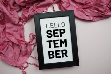 Canvas Print - Welcome September text message with pink scarft on pink background