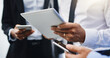 © peopleimages.com - Business people, hands and technology with tablet, cellphone and cooperation with digital app. Teamwork, group and employees with smartphone, professional and connection with website info or network