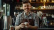 © Generative AI - Smiling male owner wearing apron holding coffee cup at cafe : Generative AI