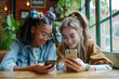 © Elena - Two friends diversity teenage girls with dreadlocks sit in cafe and look at phone. Smiling children communicate and watch videos. Generative AI