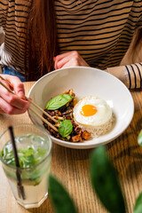 Poster - woman eating in the asian cafe