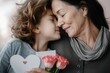© vefimov - A woman and a young girl hold a bouquet of flowers, enjoying a special moment together