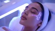 © Kingboy - Woman receiving a futuristic beauty treatment