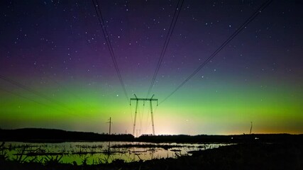 Wall Mural - Silhouette of power lines with Aurora Borealis above, time lapse view