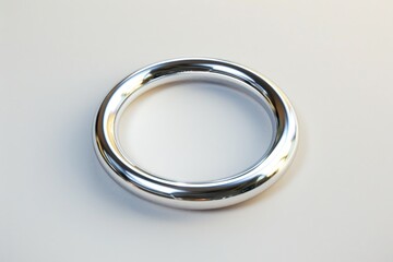 Poster - A close-up shot of a silver ring sitting on a plain white surface