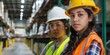 © Da - Two young hispanic female warehouse workers wearing hard hats and reflective vests looking at the camera, independent women, Labor Day, working day, New Year, Spring Festival, Christmas, overtime, HD